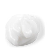 Close-up of creamy white texture of Philip B Botanical Weightless Volumizing Conditioner, ideal for hydrating and detangling hair.