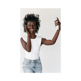 Model using Circadia White Willow and Juniper Clearing Mist face serum, ideal for acne-prone and oily skin care routines.